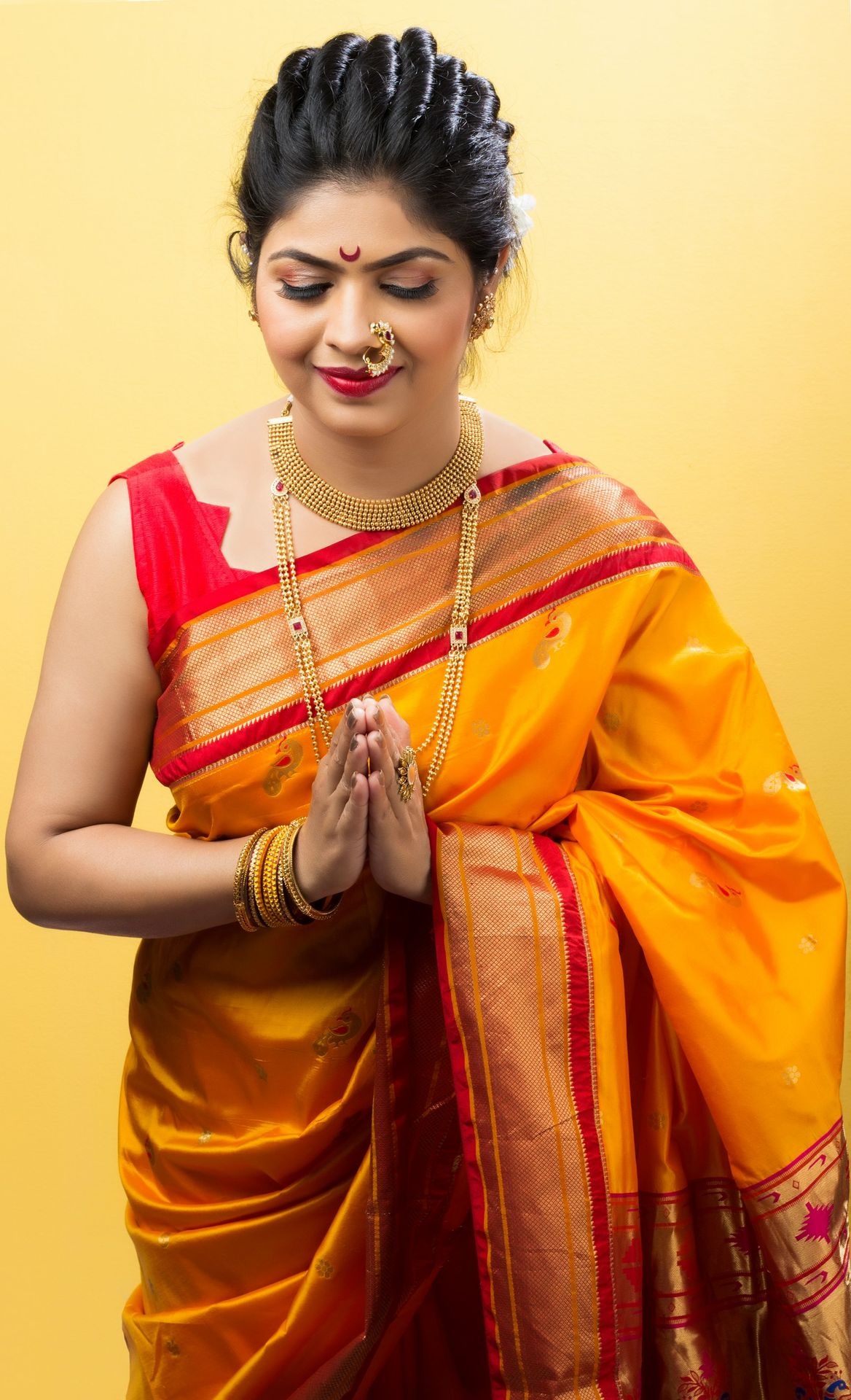 woman in yellow and red sari